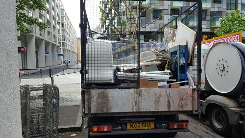 Recycling materials being loaded into an enclosed skip
